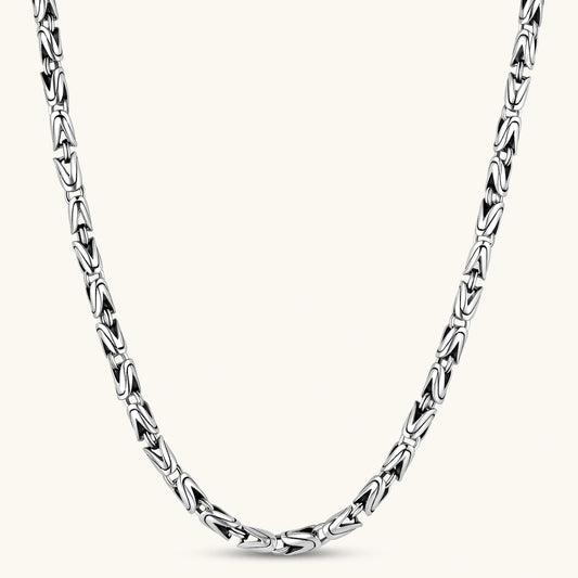 Men's antique silver Byzantine chain necklace, 6.2mm wide interlocking S-link pattern with ornate lobster clasp, 560mm length.
